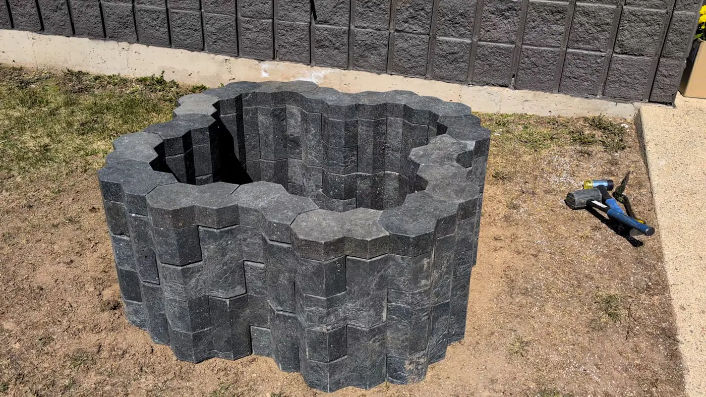 A fully assembled LinX flower bed, demonstrating the seamless, mortar-free construction process that drastically reduces labour time.