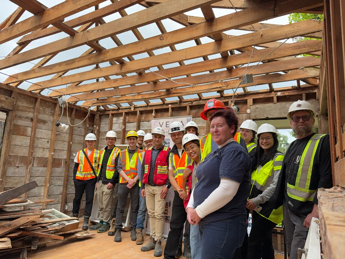 The VEMA Deconstruction crew inside a house stripped to its wood frame