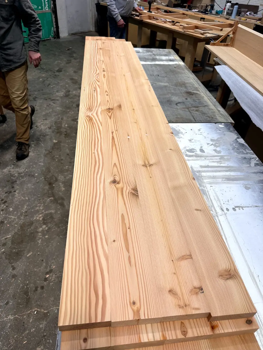 Reclaimed old-growth lumber, denailed and stacked for reuse